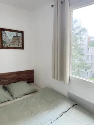 Un ou plusieurs lits dans un hébergement de l'établissement Nouveau Appartement 2p parisien