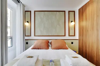 Un ou plusieurs lits dans un hébergement de l'établissement Residence Pelican - Louvre