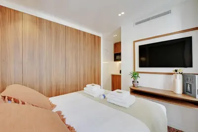Un ou plusieurs lits dans un hébergement de l'établissement Residence Pelican - Louvre