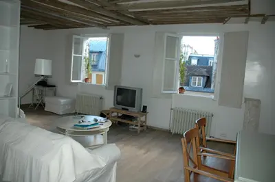 Un ou plusieurs lits dans un hébergement de l'établissement Charming flat in the heart of Paris