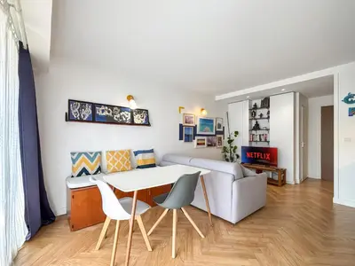 Coin salon dans l'établissement Appartement Avec Piscine Métro Convention