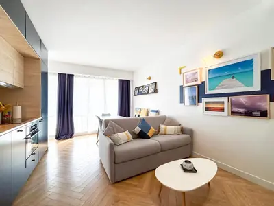 Coin salon dans l'établissement Appartement Avec Piscine Métro Convention