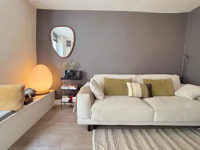 Coin salon dans l'établissement L'appartement Charlot C
