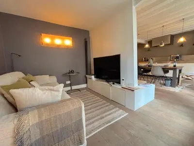 Télévision ou salle de divertissement dans l'établissement L'appartement Charlot C