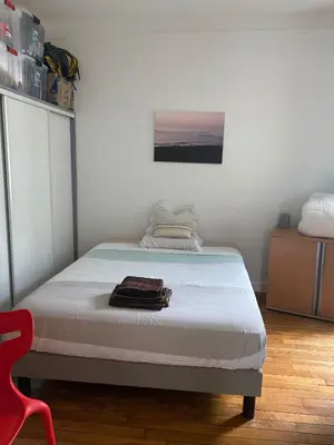 Un ou plusieurs lits dans un hébergement de l'établissement Appartement typique parisien Paris 15