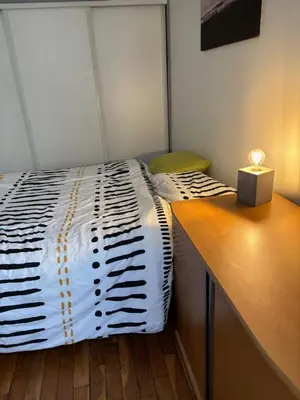 Un ou plusieurs lits dans un hébergement de l'établissement Appartement typique parisien Paris 15