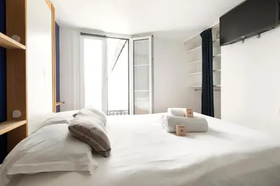 Un ou plusieurs lits dans un hébergement de l'établissement Charming studio in La Bastille - 1BDR