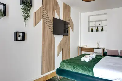 Un ou plusieurs lits dans un hébergement de l'établissement Suite Thouars - Havre de paix au cœur de Paris