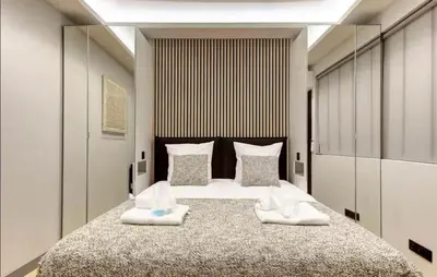 Un ou plusieurs lits dans un hébergement de l'établissement Elegant flat - 2BR-6P