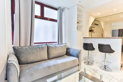Coin salon dans l'établissement Cozy apartment - 1BR 4P - Eiffel Tower