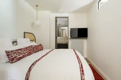 Un ou plusieurs lits dans un hébergement de l'établissement Oniri - Serviced Apartment in Saint Germain des Prés - Rue de Verneuil
