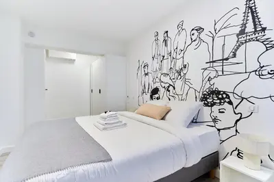 Un ou plusieurs lits dans un hébergement de l'établissement Élégant 1 chambre climatisé Tour Eiffel à pied