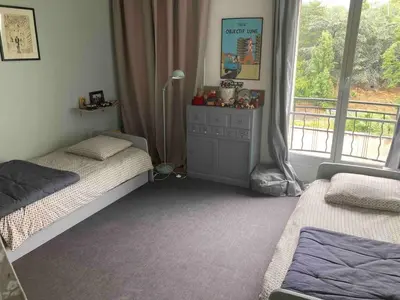 Un ou plusieurs lits dans un hébergement de l'établissement Appartement familial 140m2, vue Seine, 4 chambres