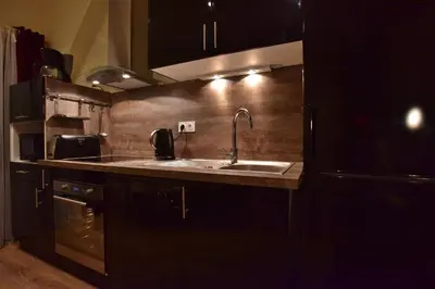 Cuisine ou kitchenette dans l'établissement Loft Deluxe du Moulin Vert