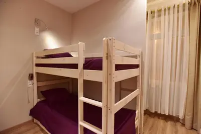Un ou plusieurs lits dans un hébergement de l'établissement Loft Deluxe du Moulin Vert