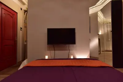 Télévision ou salle de divertissement dans l'établissement Loft Deluxe du Moulin Vert