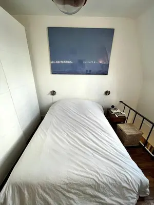Un ou plusieurs lits dans un hébergement de l'établissement Cozy and bright duplex