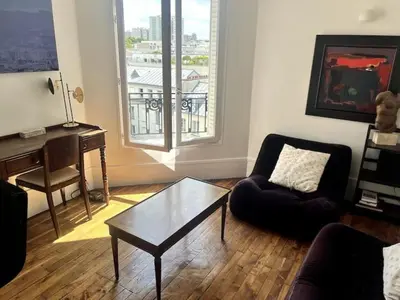 Coin salon dans l'établissement Cozy and bright duplex