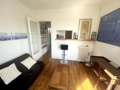 Coin salon dans l'établissement Cozy and bright duplex
