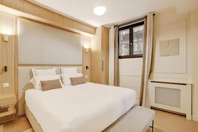 Un ou plusieurs lits dans un hébergement de l'établissement Pick A Flat's Apartment in Montorgueil - Rue Saint Sauveur