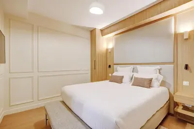 Un ou plusieurs lits dans un hébergement de l'établissement Pick A Flat's Apartment in Montorgueil - Rue Saint Sauveur