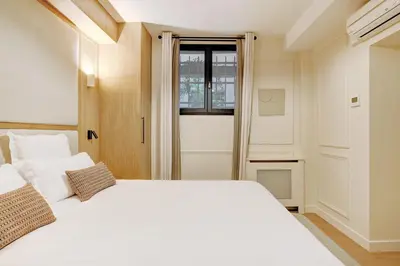 Un ou plusieurs lits dans un hébergement de l'établissement Pick A Flat's Apartment in Montorgueil - Rue Saint Sauveur