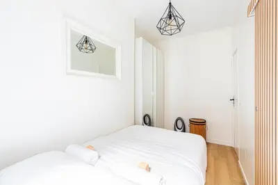 Un ou plusieurs lits dans un hébergement de l'établissement GuestReady - 11th Arr. comfortable retreat