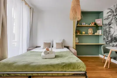 Un ou plusieurs lits dans un hébergement de l'établissement Studio Chic & Bohème aux Portes de Paris