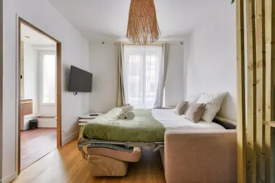 Un ou plusieurs lits dans un hébergement de l'établissement Studio Chic & Bohème aux Portes de Paris