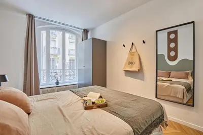 Un ou plusieurs lits dans un hébergement de l'établissement Avina - 3 chambres à Trocadéro