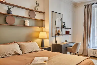 Un ou plusieurs lits dans un hébergement de l'établissement Avina - 3 chambres à Trocadéro