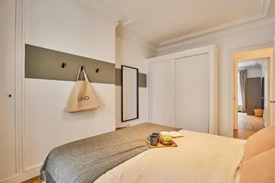 Un ou plusieurs lits dans un hébergement de l'établissement Avina - 3 chambres à Trocadéro