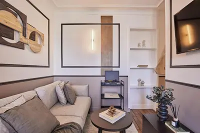 Coin salon dans l'établissement Isena - 1 chambre et balcon à École Militaire