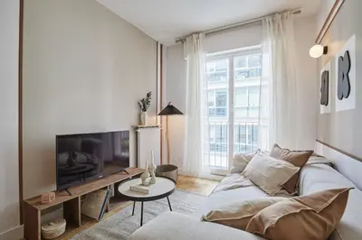 Télévision ou salle de divertissement dans l'établissement Xalea - 2 chambres à Trocadéro