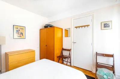 Un ou plusieurs lits dans un hébergement de l'établissement GuestReady - Amazing home near the Eiffel Tower