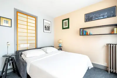 Un ou plusieurs lits dans un hébergement de l'établissement GuestReady - Amazing home near the Eiffel Tower