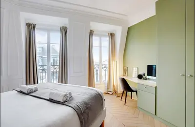 Un ou plusieurs lits dans un hébergement de l'établissement Appartement chic avec vue - Montorgueil
