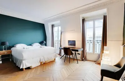 Un ou plusieurs lits dans un hébergement de l'établissement Appartement chic avec vue - Montorgueil