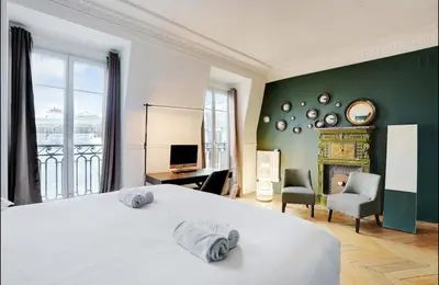 Un ou plusieurs lits dans un hébergement de l'établissement Appartement chic avec vue - Montorgueil