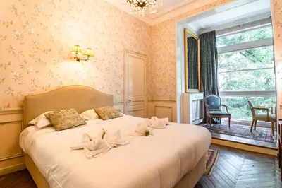 Un ou plusieurs lits dans un hébergement de l'établissement Victor Hugo - Charmante Villa de Luxe