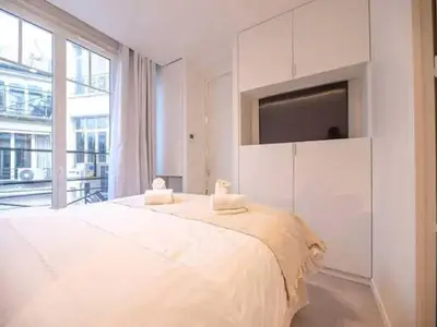 Un ou plusieurs lits dans un hébergement de l'établissement Superb Appt with AC - 2BD 6P - Madeleine Opera