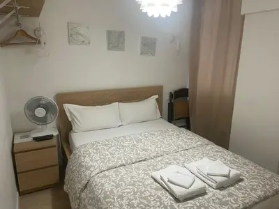 Un ou plusieurs lits dans un hébergement de l'établissement Charmant studio dans le Haut Marais