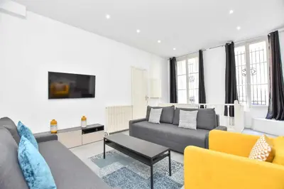 Coin salon dans l'établissement Cozy apartment - 1BR-6P - Madeleine