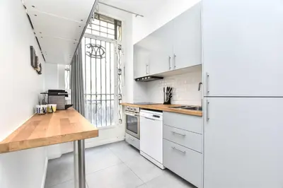 Cuisine ou kitchenette dans l'établissement Cozy apartment - 1BR-6P - Madeleine