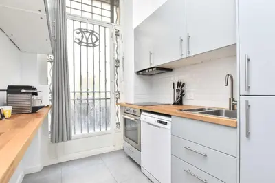 Cuisine ou kitchenette dans l'établissement Cozy apartment - 1BR-6P - Madeleine