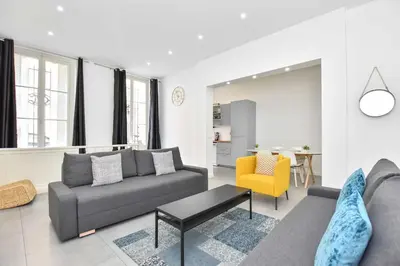 Coin salon dans l'établissement Cozy apartment - 1BR-6P - Madeleine