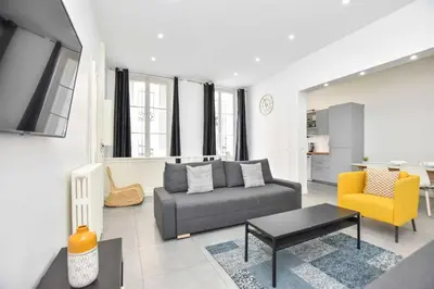 Coin salon dans l'établissement Cozy apartment - 1BR-6P - Madeleine