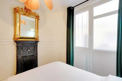 Un ou plusieurs lits dans un hébergement de l'établissement Cosy Appt - 1BDR-2P - Montmartre