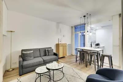 Coin salon dans l'établissement Modern apartment - 2BR-6P-Oberkampf