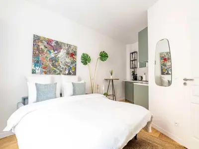 Un ou plusieurs lits dans un hébergement de l'établissement Cosy Studio 2p Le Marais